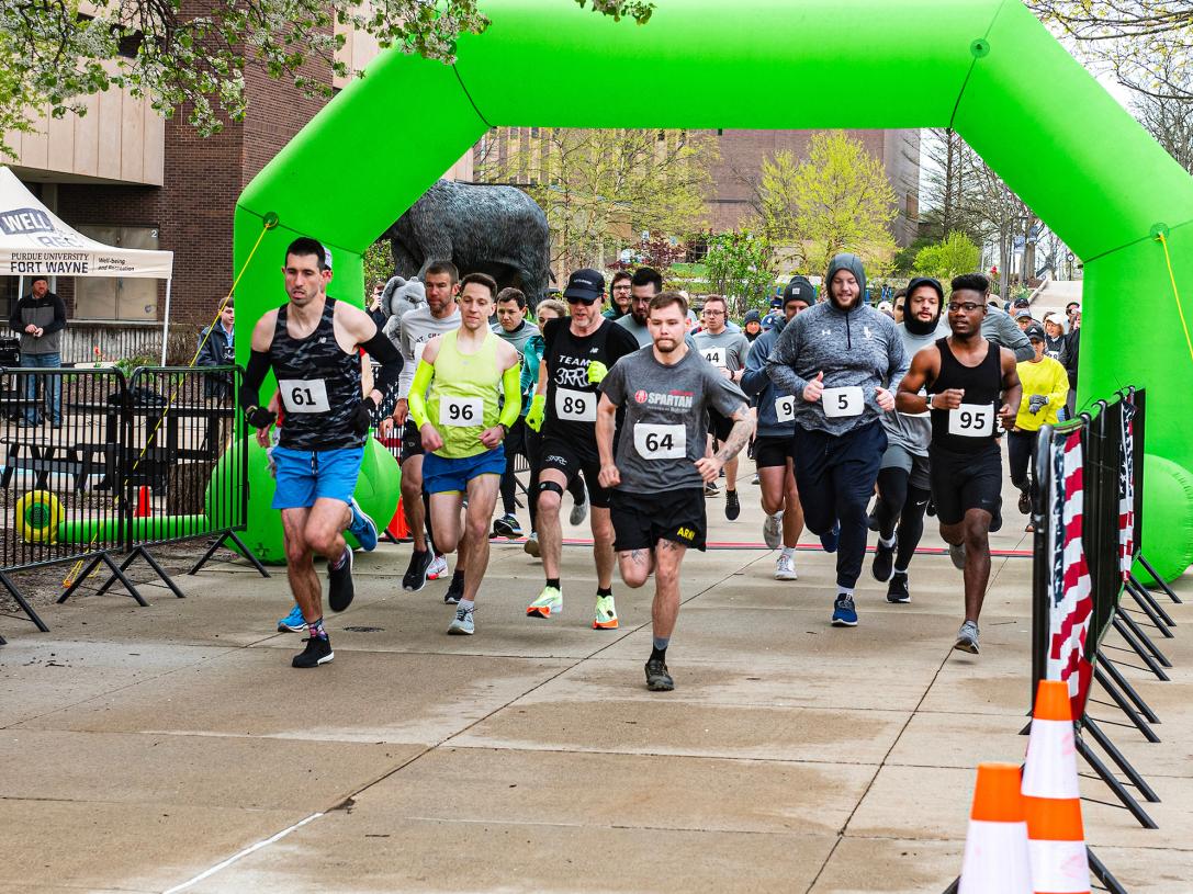 Community members and PFW employees participate in a 5K.