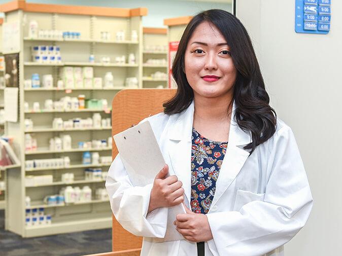 Pharmacist standing in a lab coat