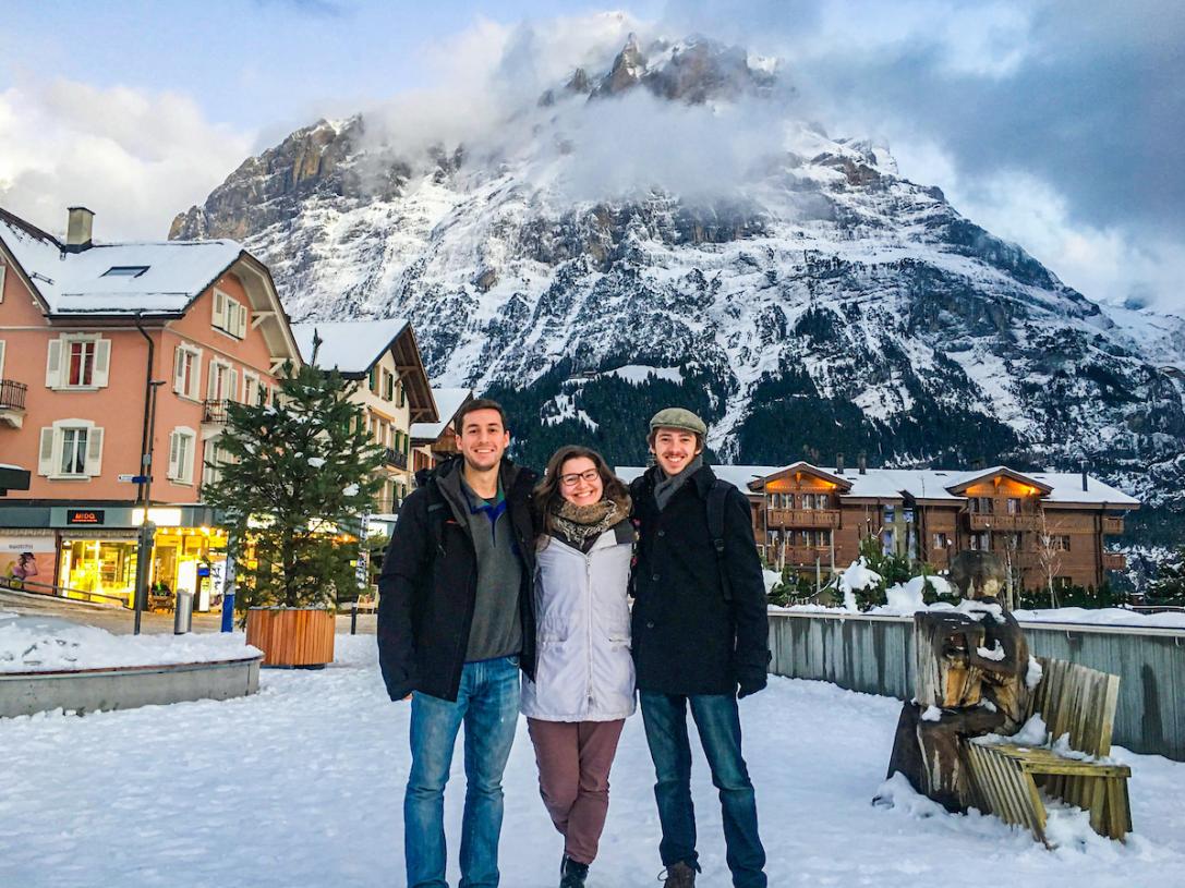 Students standing in front of a mountain