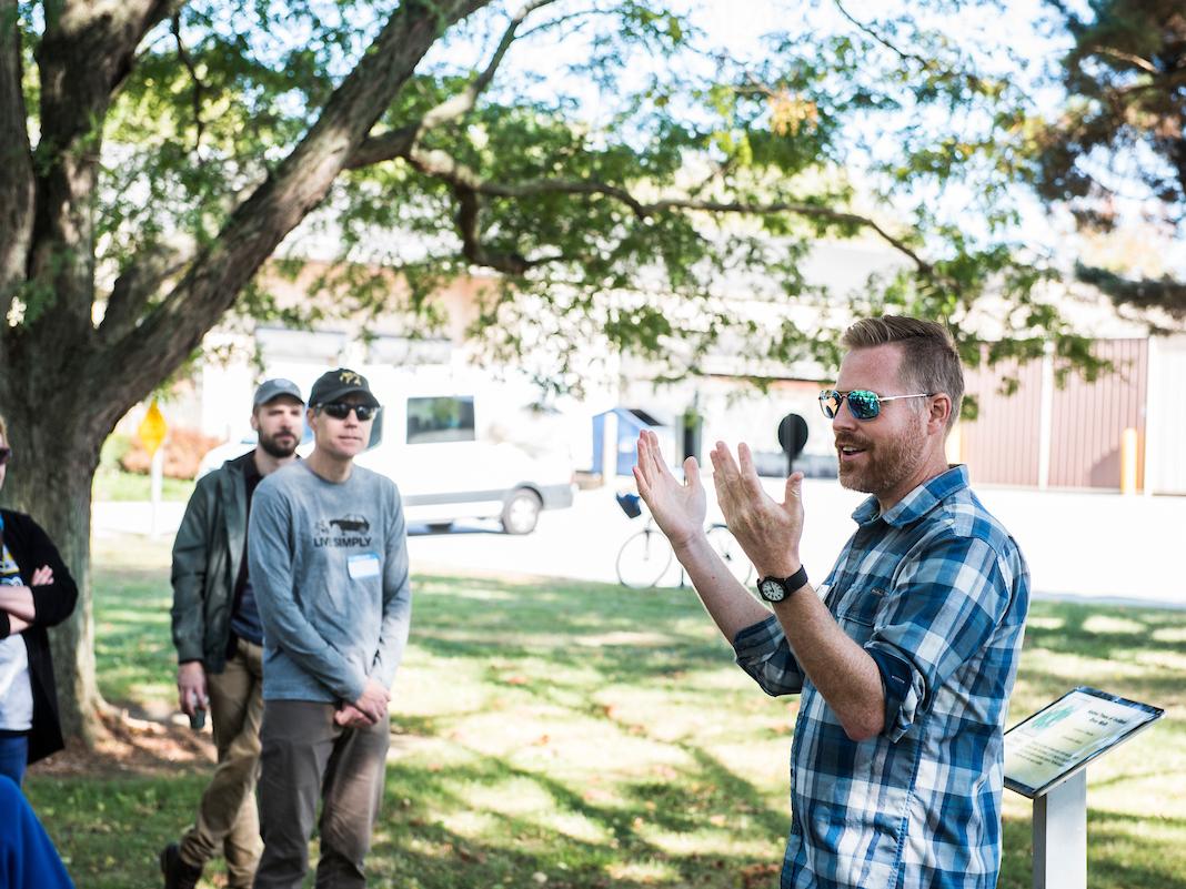A person talking to a group of people