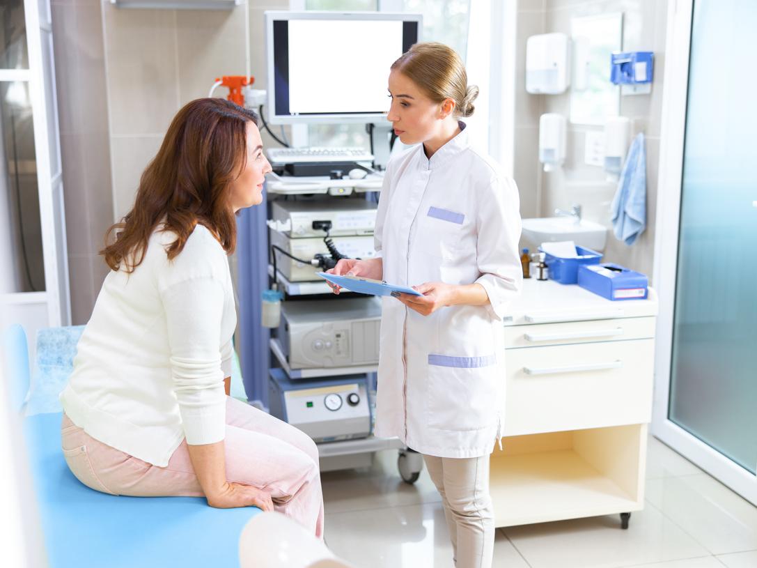 Health clinic worker with patient