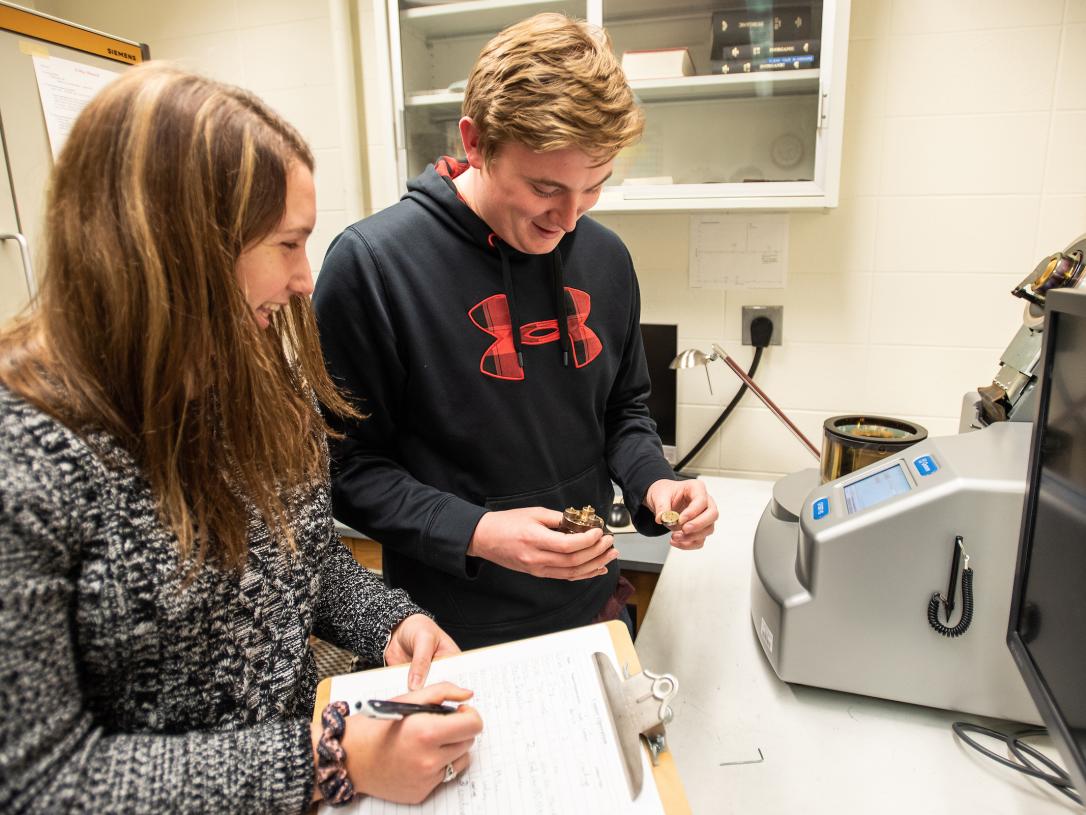 Students using coating machine