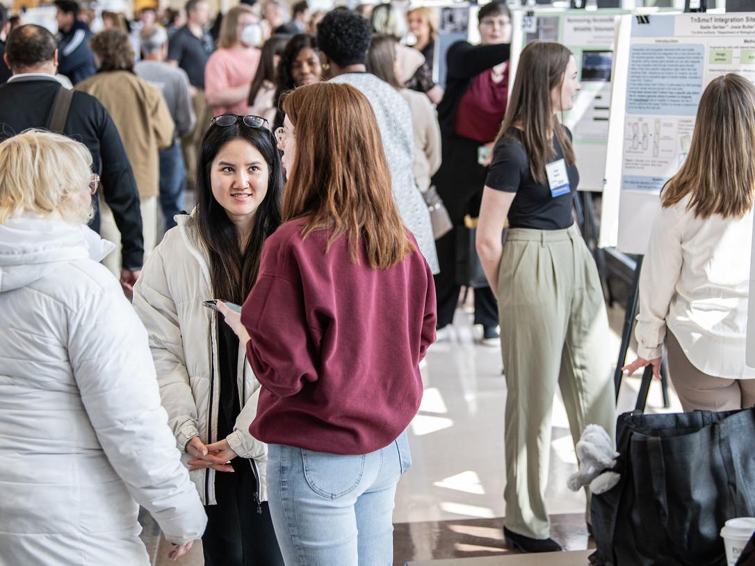 Crowd shot at the research symposium on the skybridge