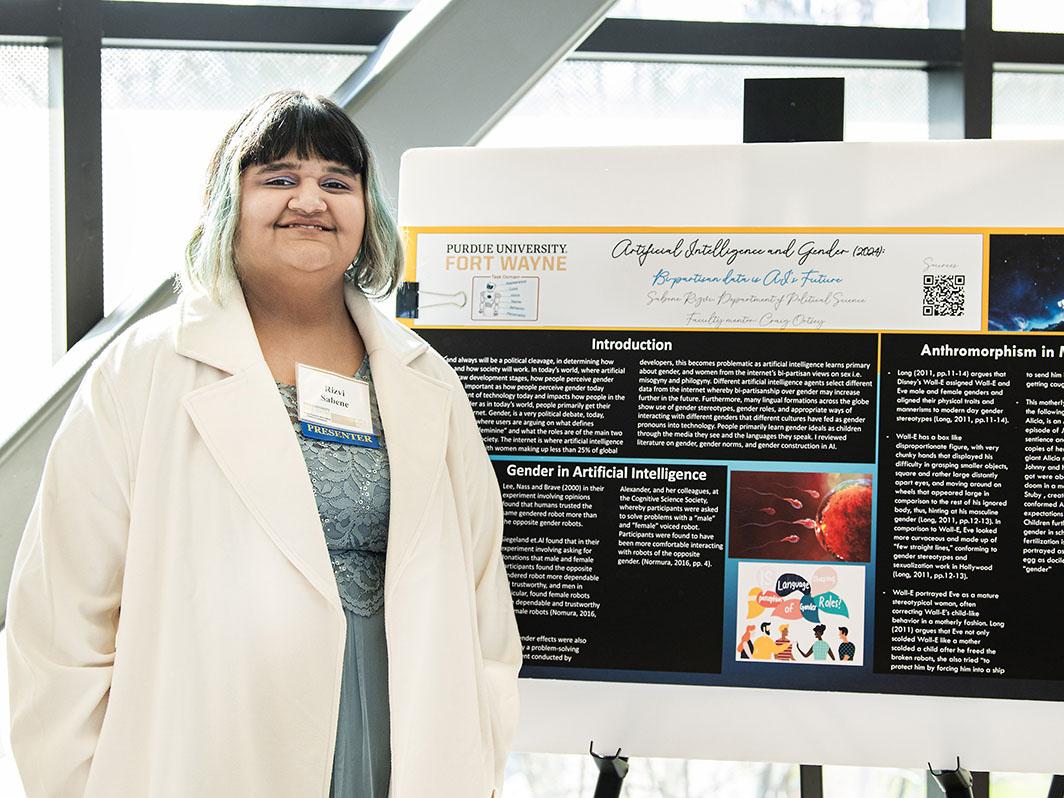 A student with her research poster