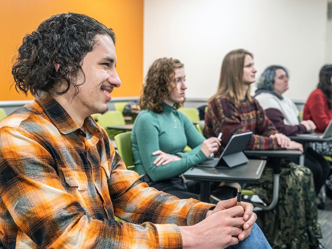 Students listening to professor in class