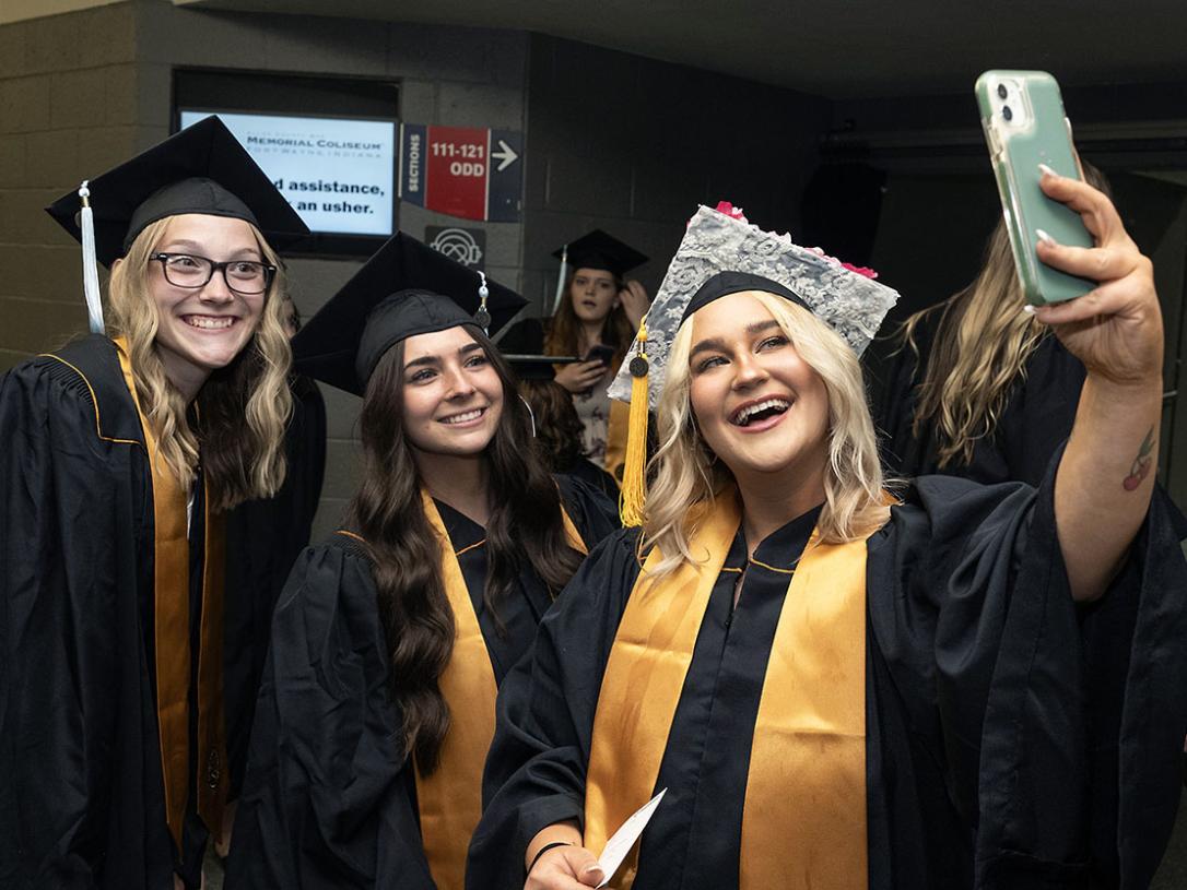 Smiling students at commencement