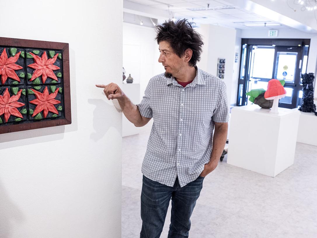 Derek Decker in an art gallery