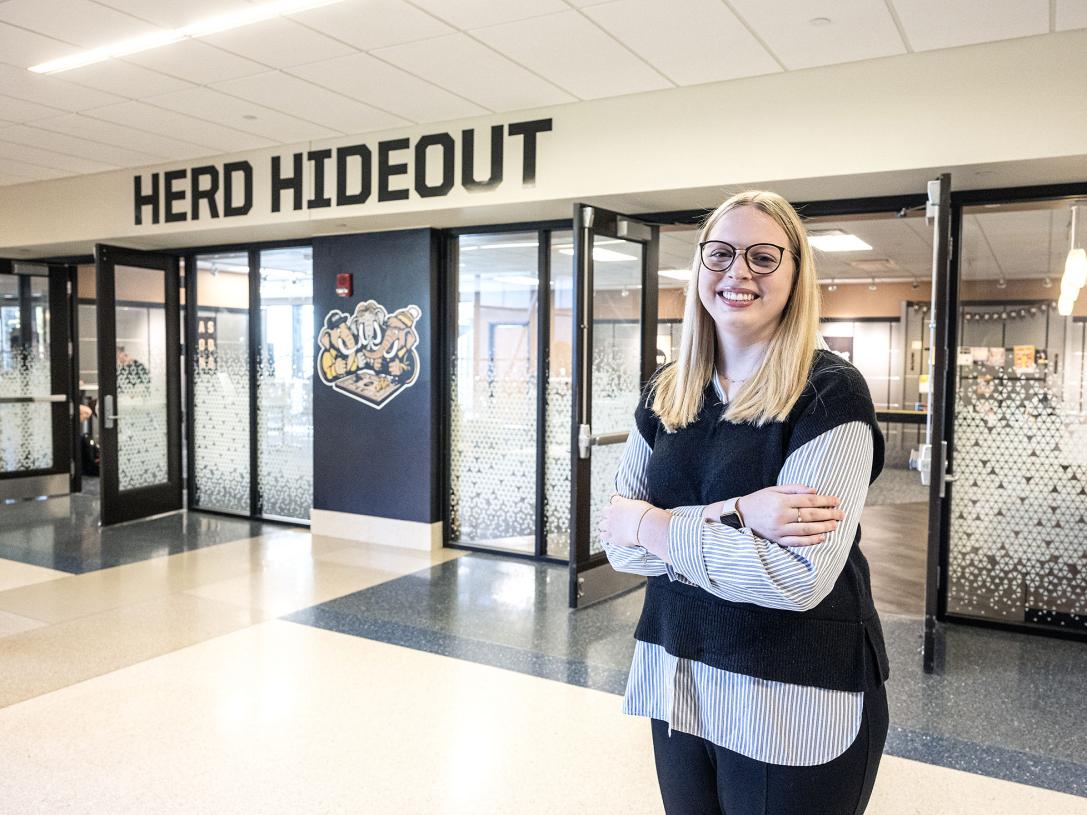 Mikayla Haggarty standing outside of the Herd Hideout