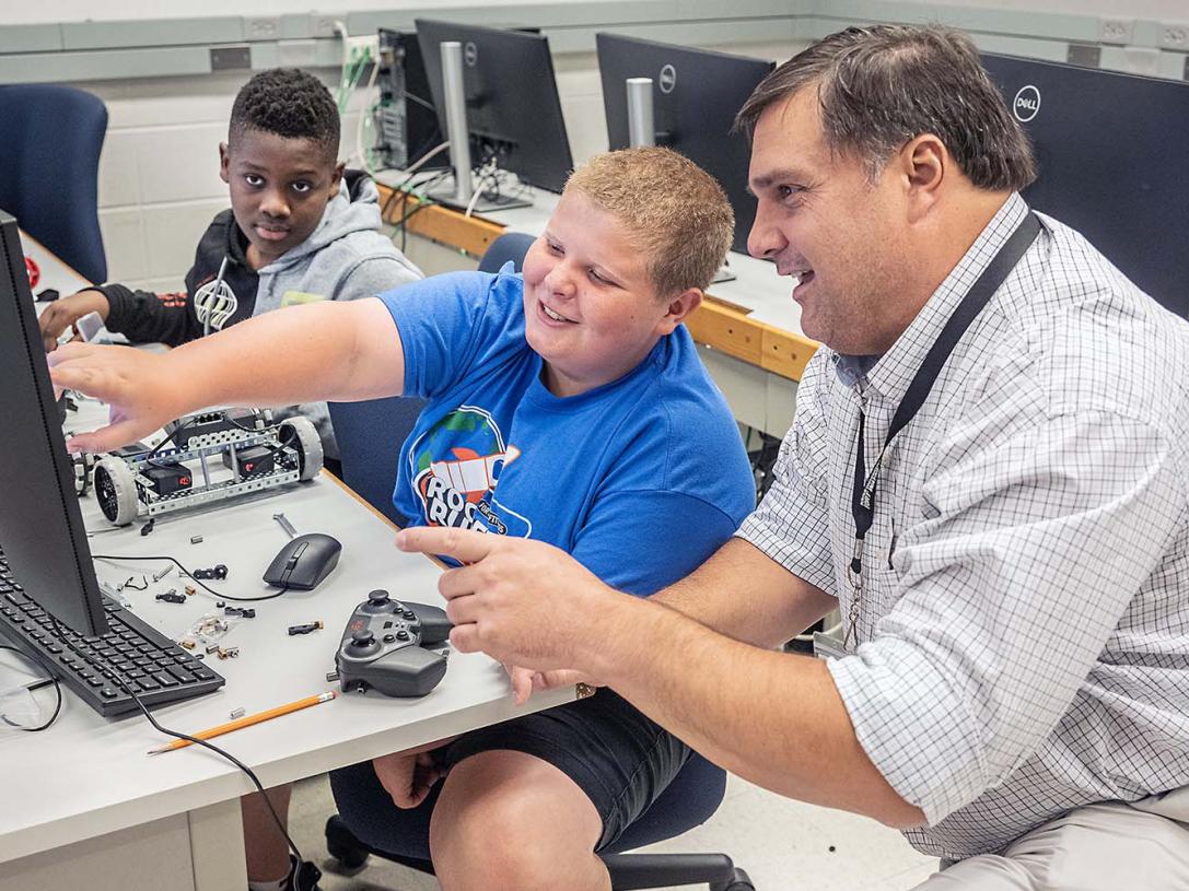Jeff Nowak is working with students at a summer camp
