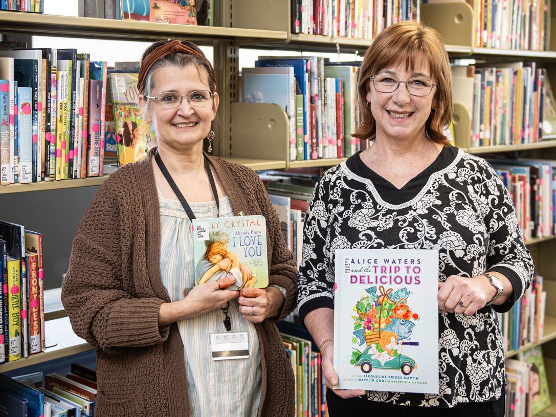 Emily Tock and Elizabeth Christian display children’s books
