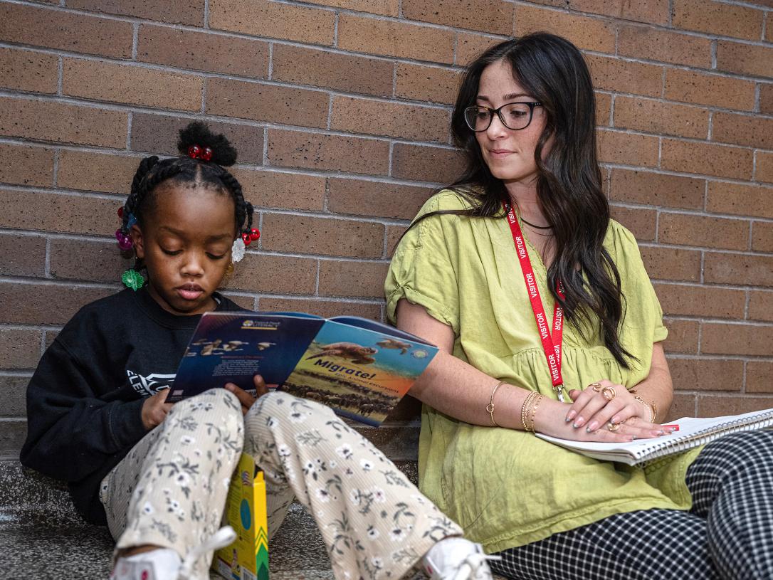 Student teacher works one-on-one with an elementary student.