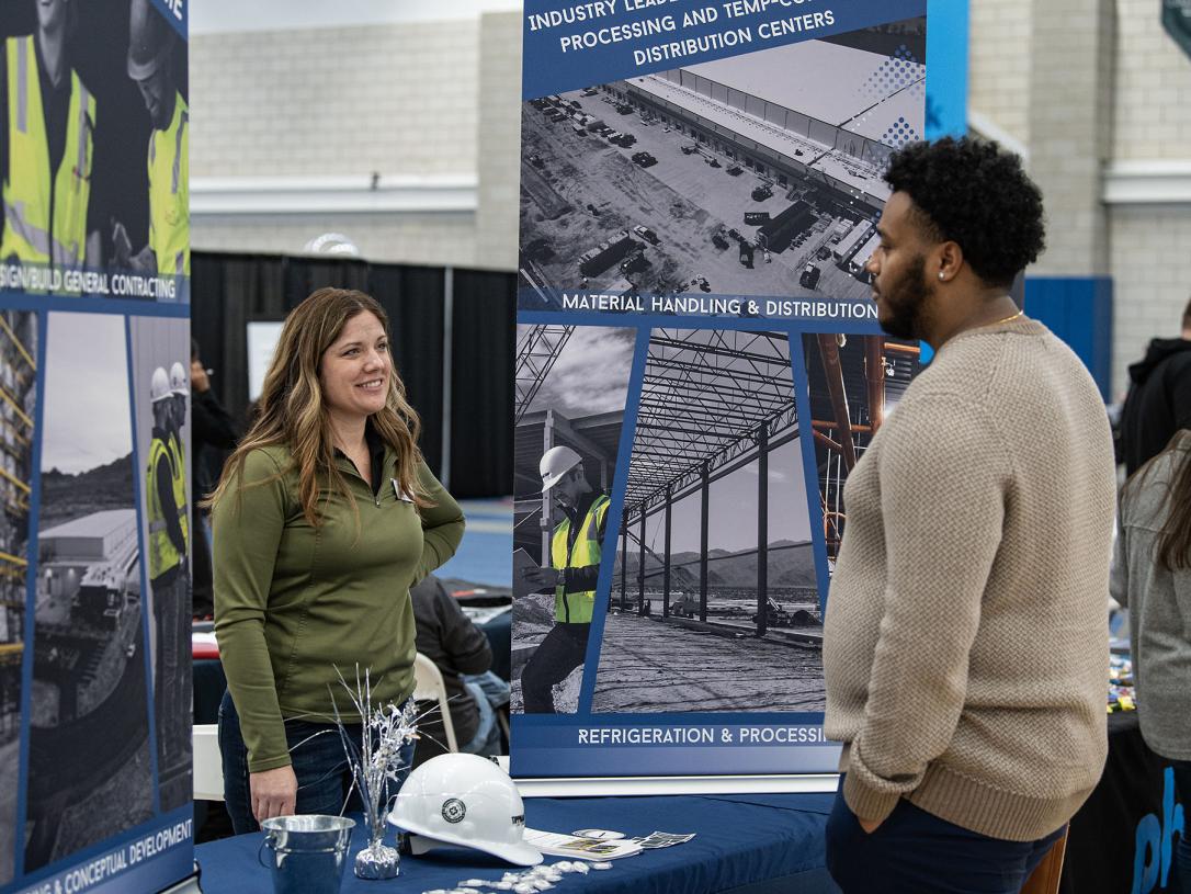 A student and employer at a career expo