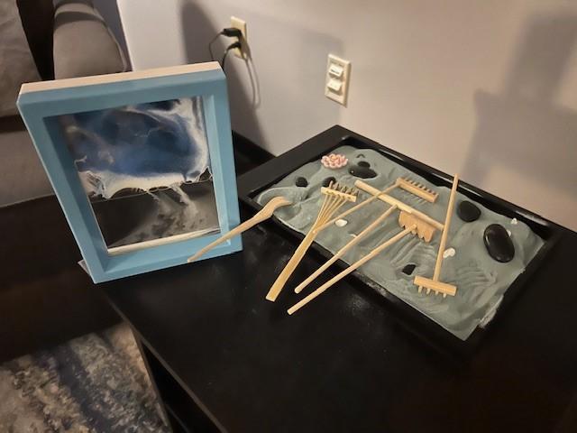 Zen garden on a table in the low-sensory room.
