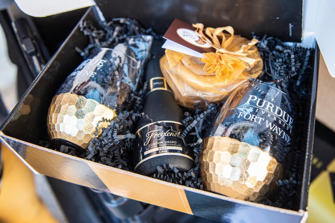 PFW branded wine mugs in a philanthropy gift box. 