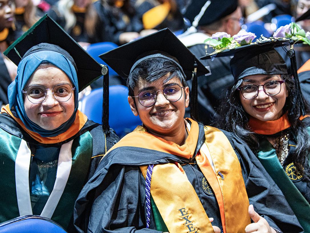 Three graduates