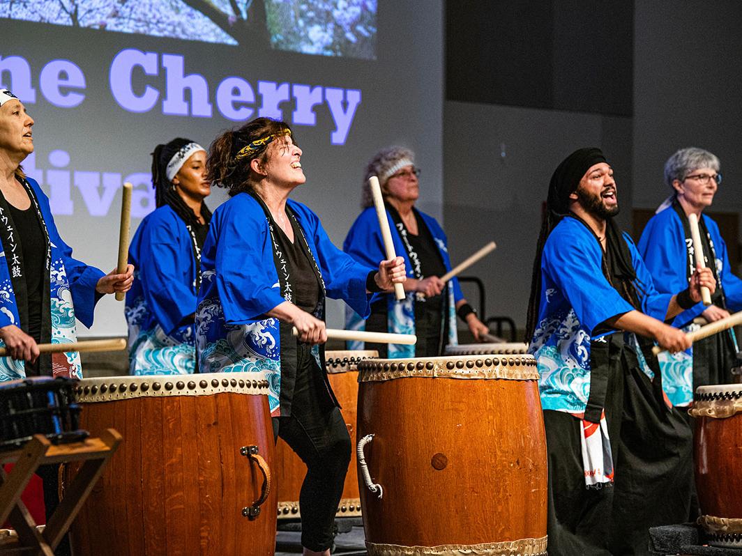 Taiko drummers are performing at the Cherry Blossom Festival