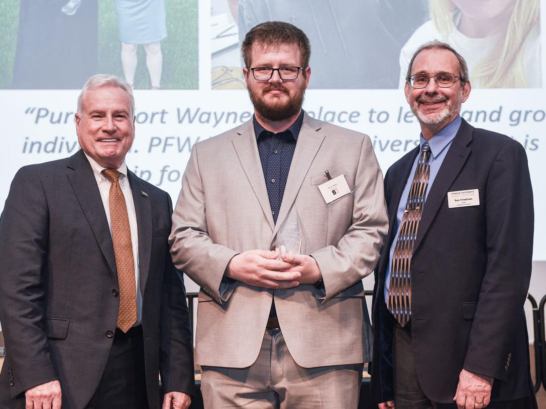 Chancellor Ron Elsenbaumer, Ryan Miller, and Dean Ron Friedman