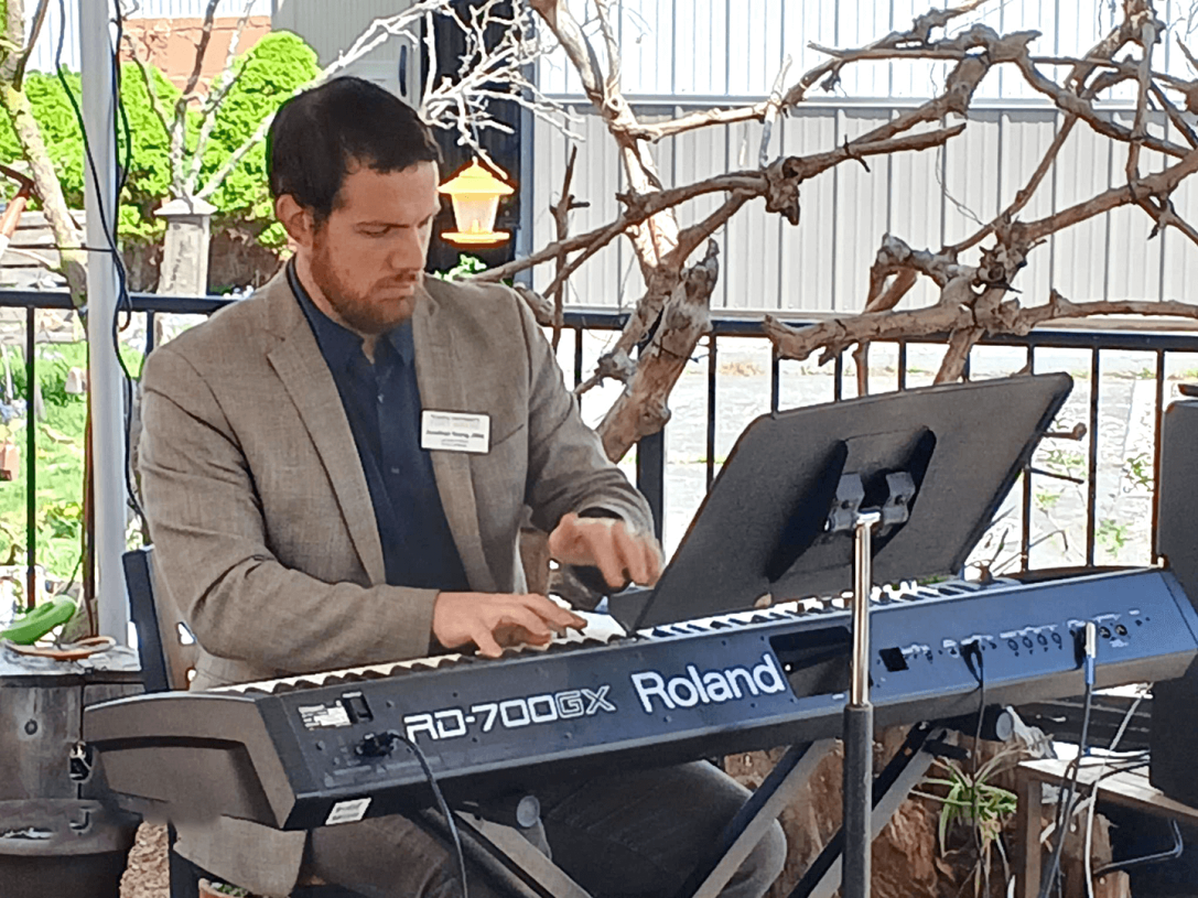 Jonathan Young playing a piano