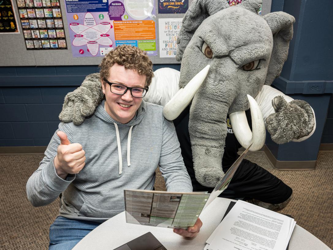 Student studying with Don