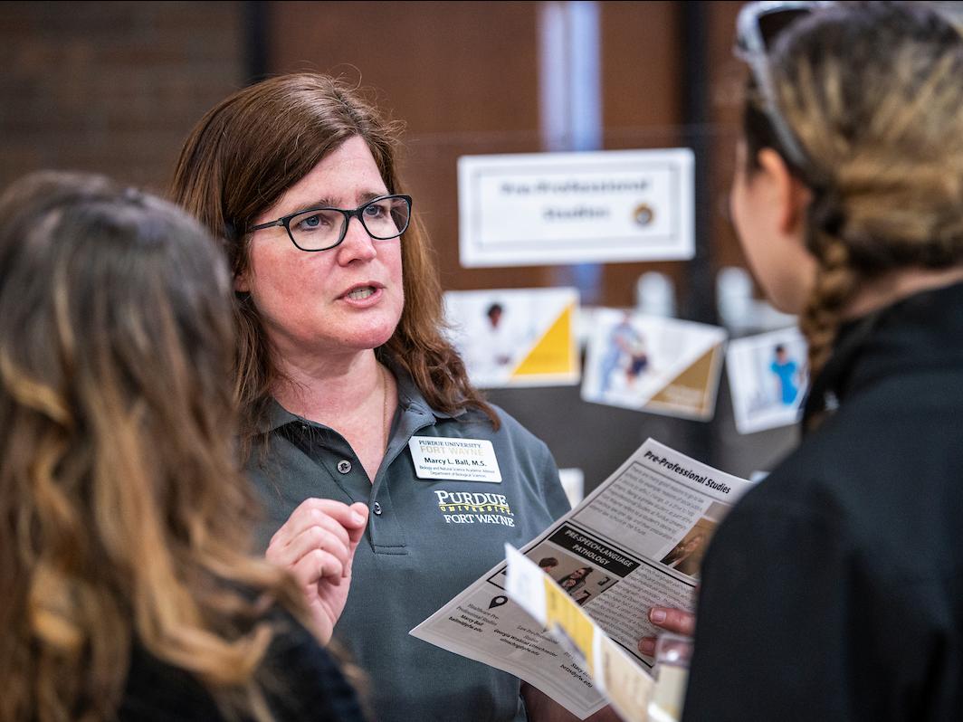 Staff talking to prospective students