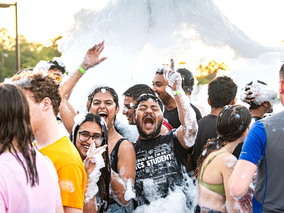 Students are having fun at a foam party
