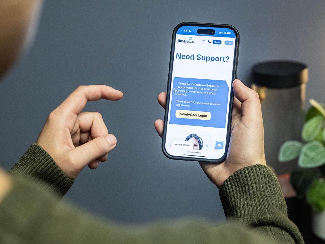 A student is using the TimelyCare app on their phone