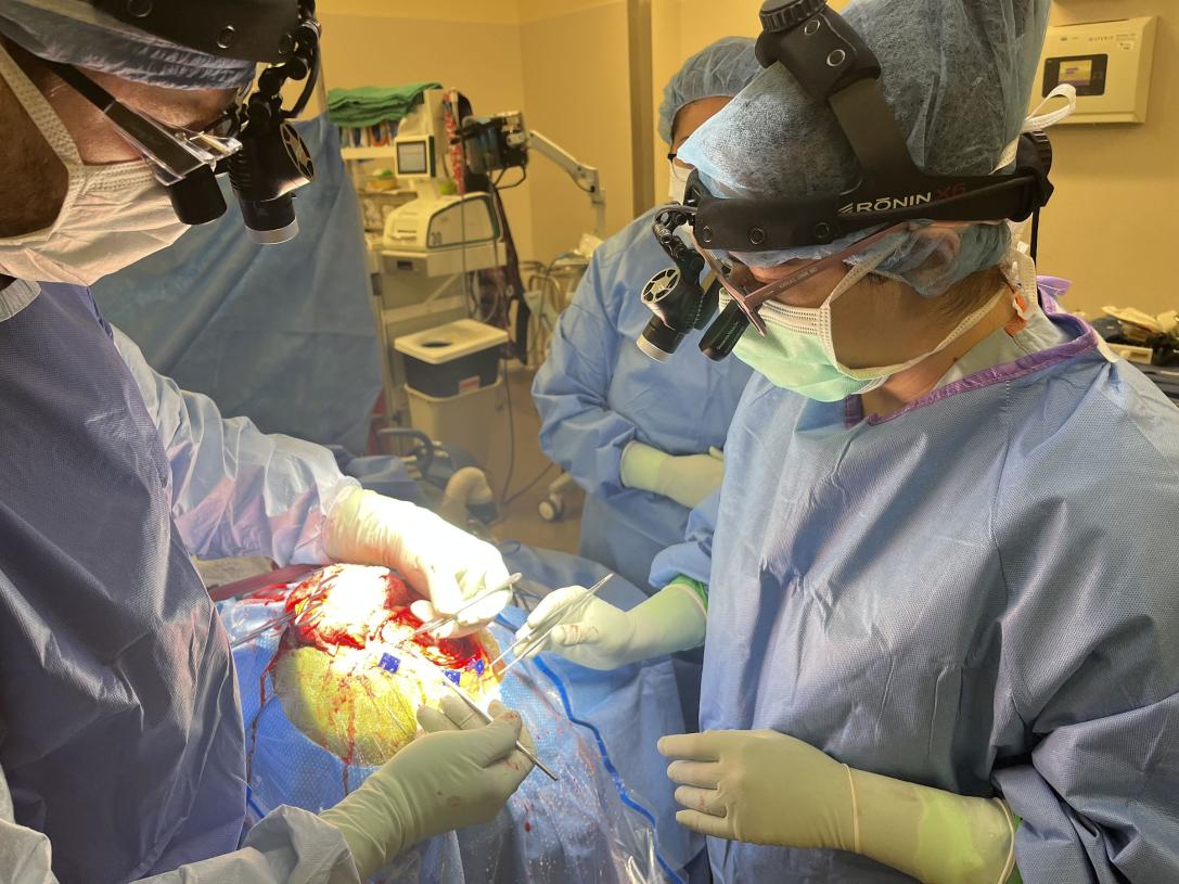 Kayla Chin is performing surgery in an operating room