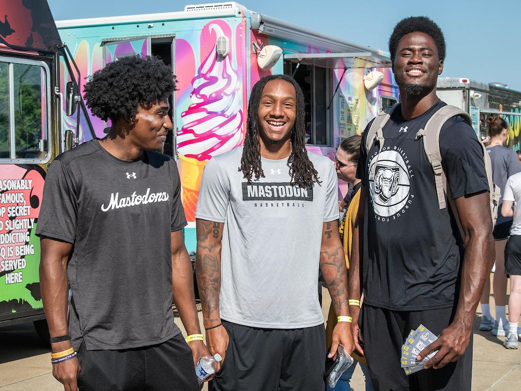 PFW students hanging near the food trucks at the Party at the Pitch event.