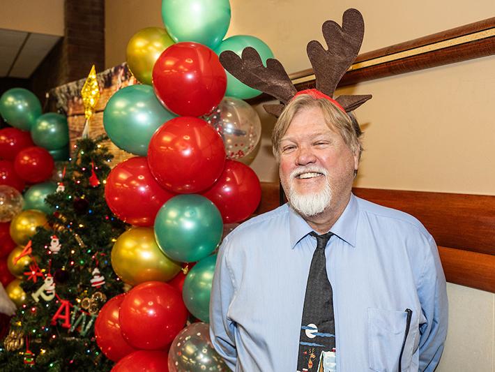 Curt Hosier is wearing reindeer antlers