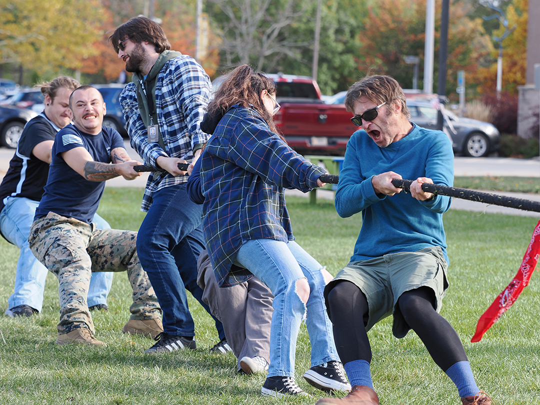 Dr. Schuster pulls with students during the Tug-o-War Rematch 