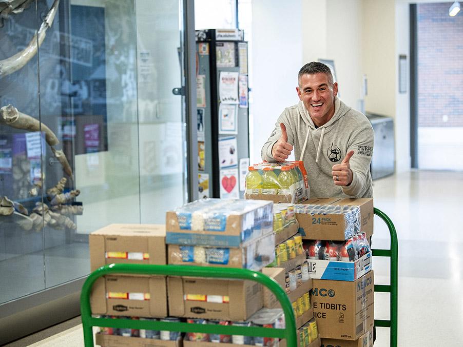 Eric Manor is moving items into a food pantry