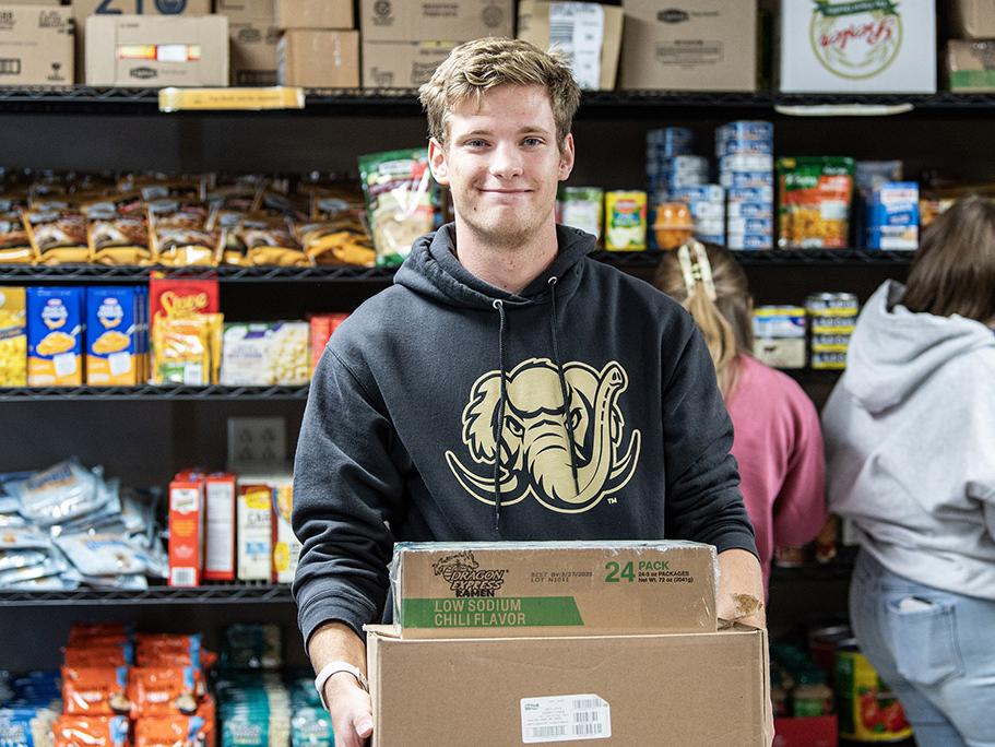 A student is working in the food pantry
