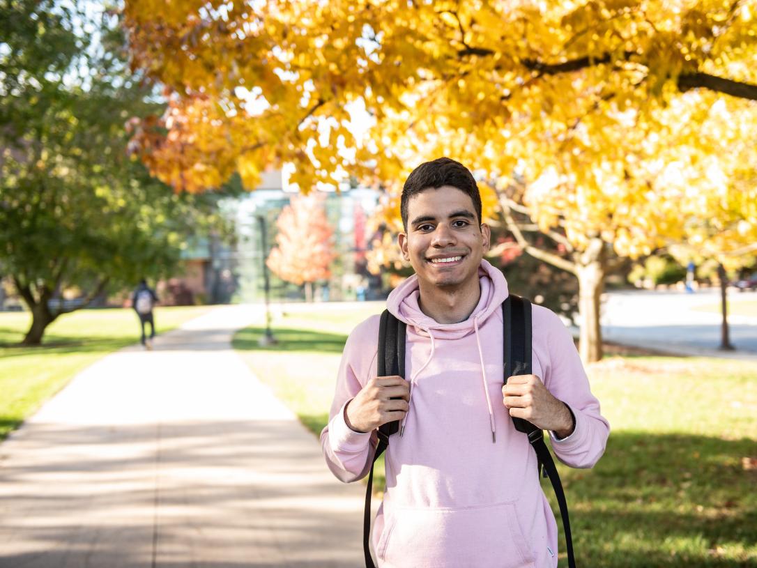 A student standing on campus.