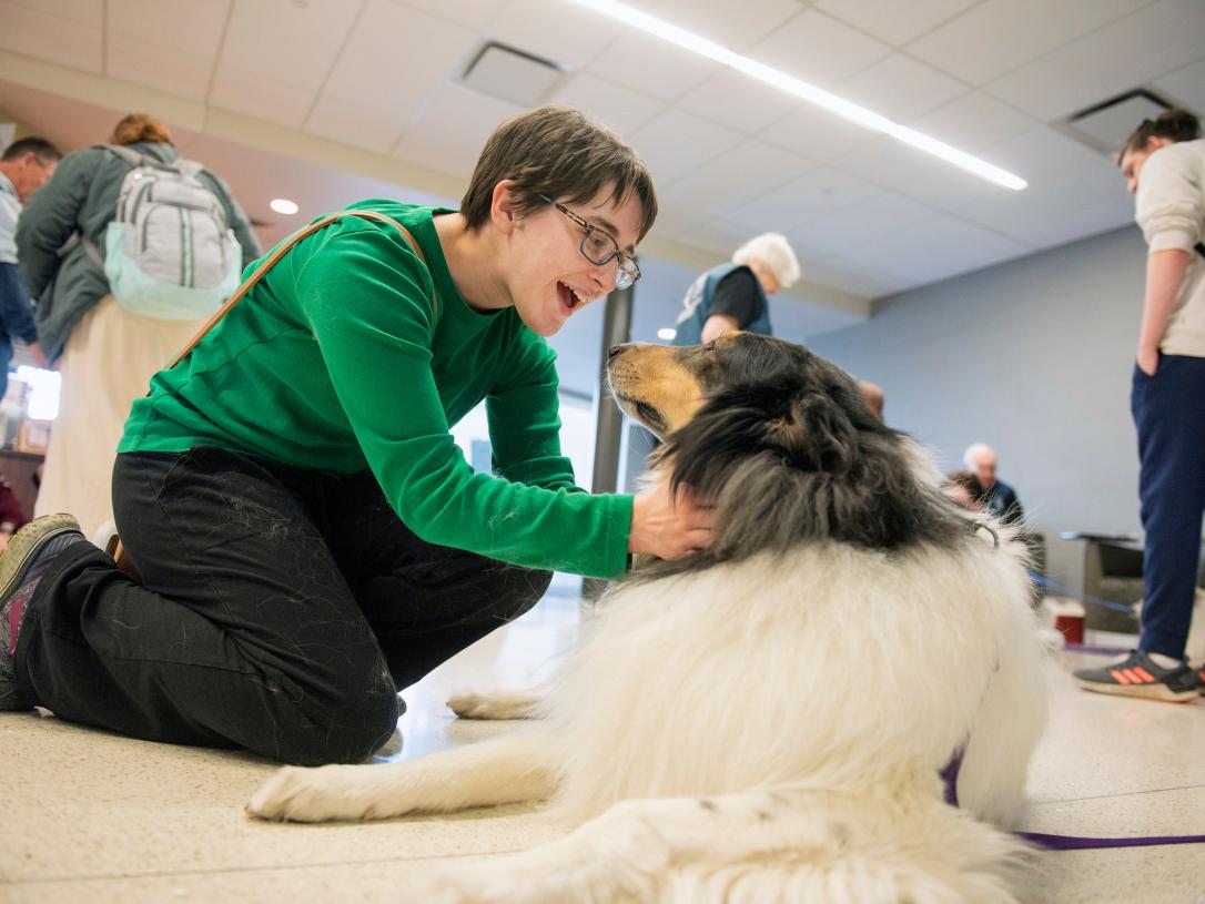 Student with a therapy dog.
