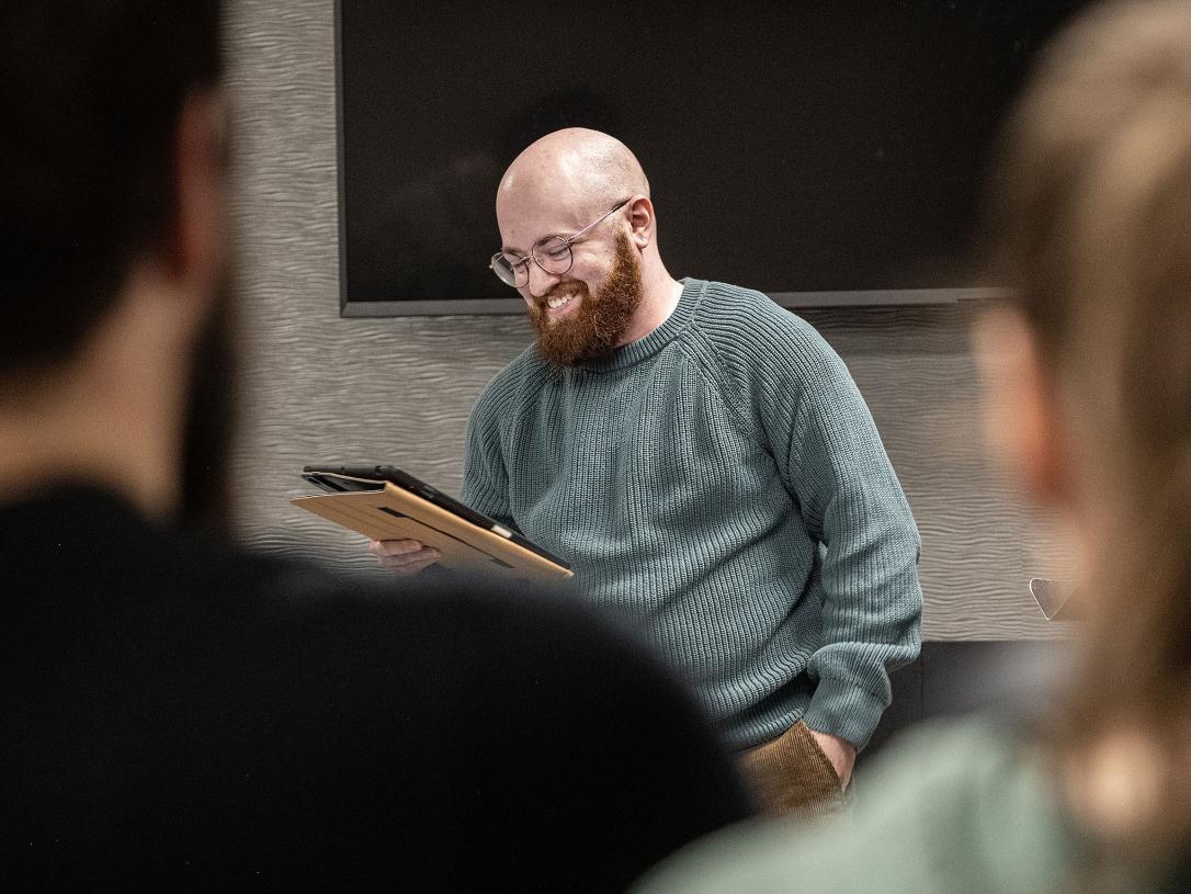Eden Bailey is reading a poem in a classroom