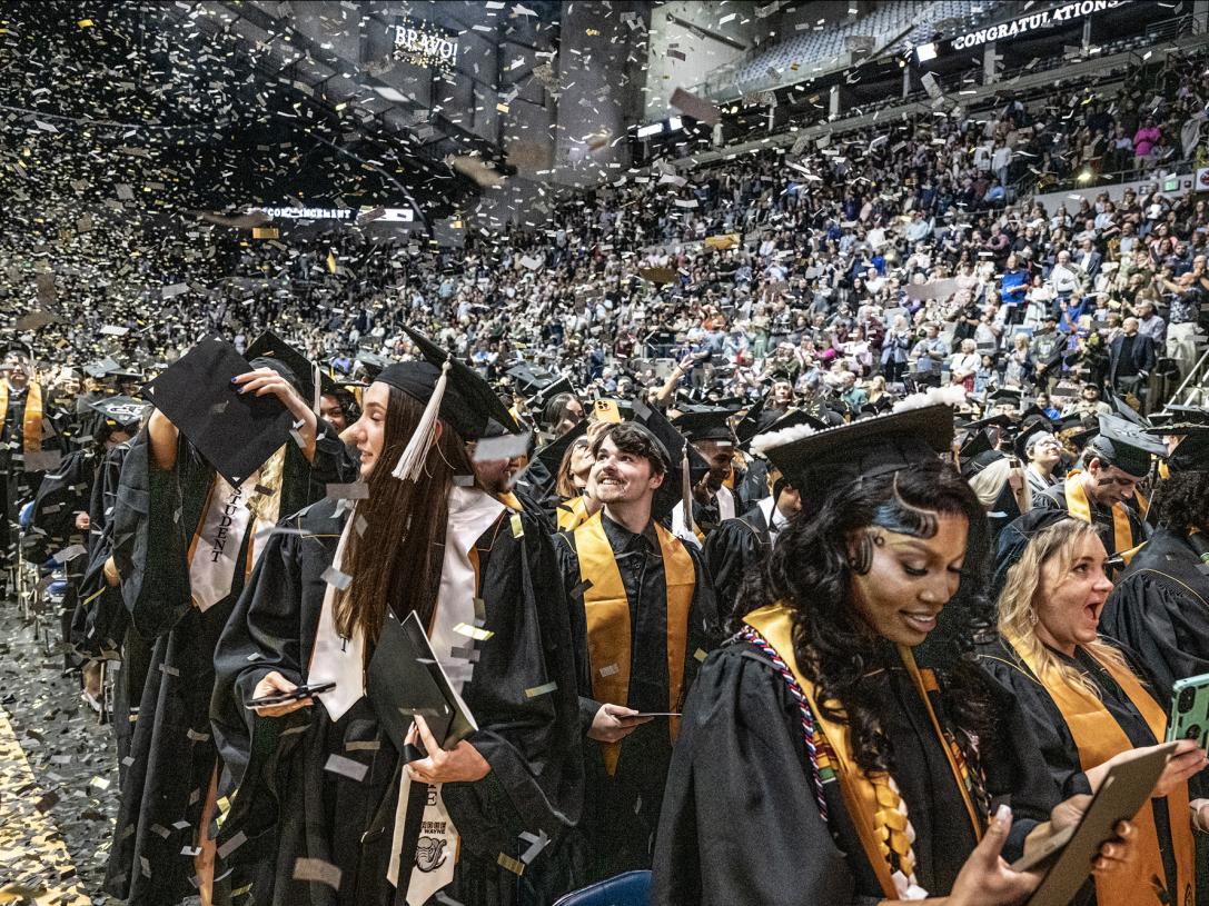 Students celebrate at the end of the 2026 commencement ceremony