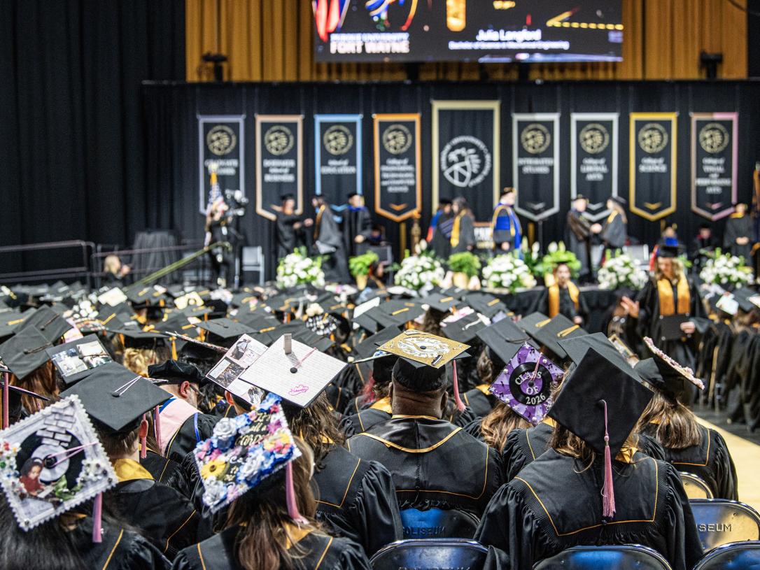 A view of the 2026 commencement ceremony stage from a student's perspective