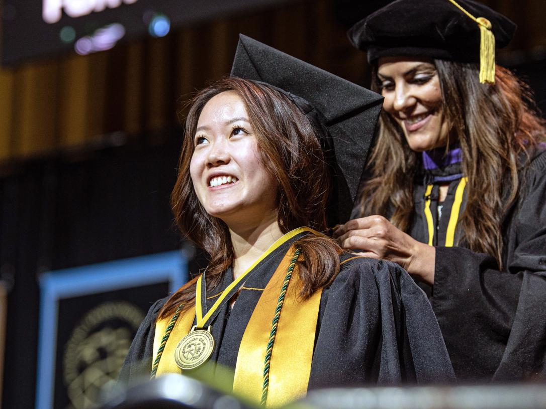 A female student recieves recognition during the 2026 commencement ceremony