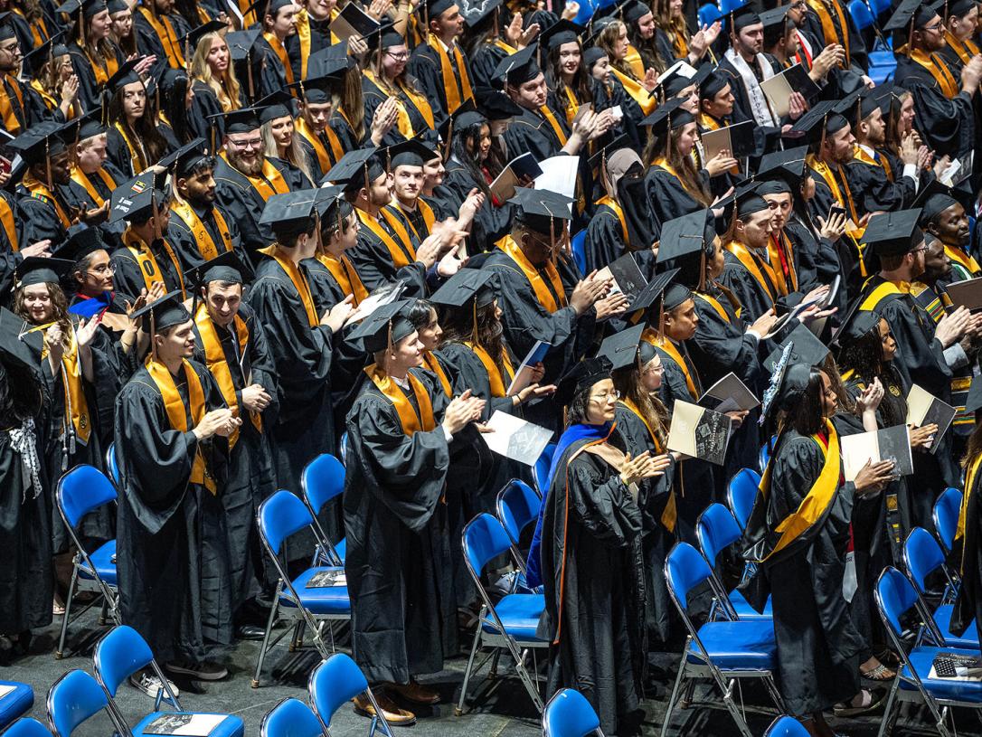 Group shot of many graduates at commencement