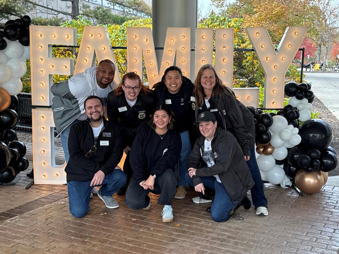 A group of people are posing for a photo at PFW's Family Day
