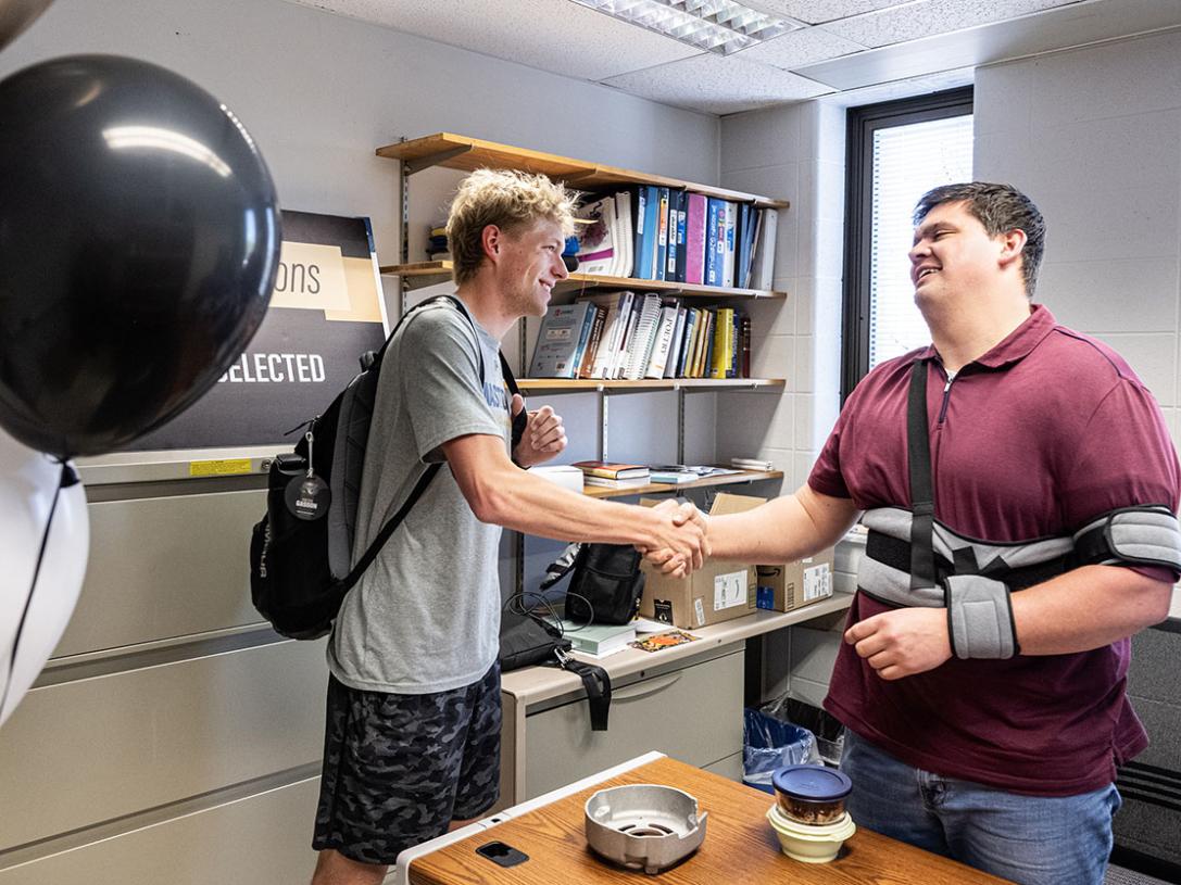 A person is being awarded a certificate