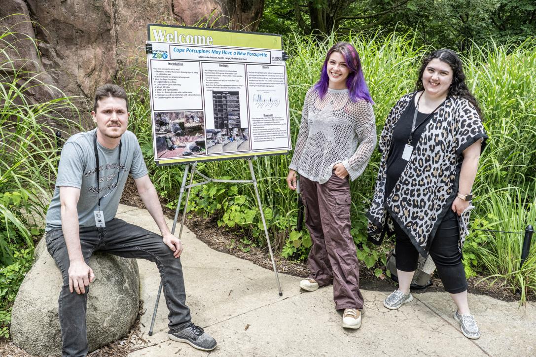 Student and instructor presenting presentation at the zoo.