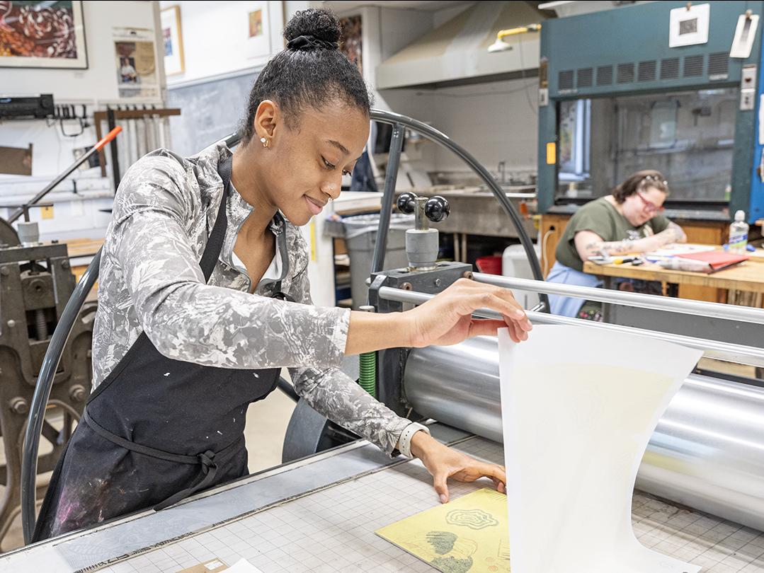 A student works in the printmaking lab