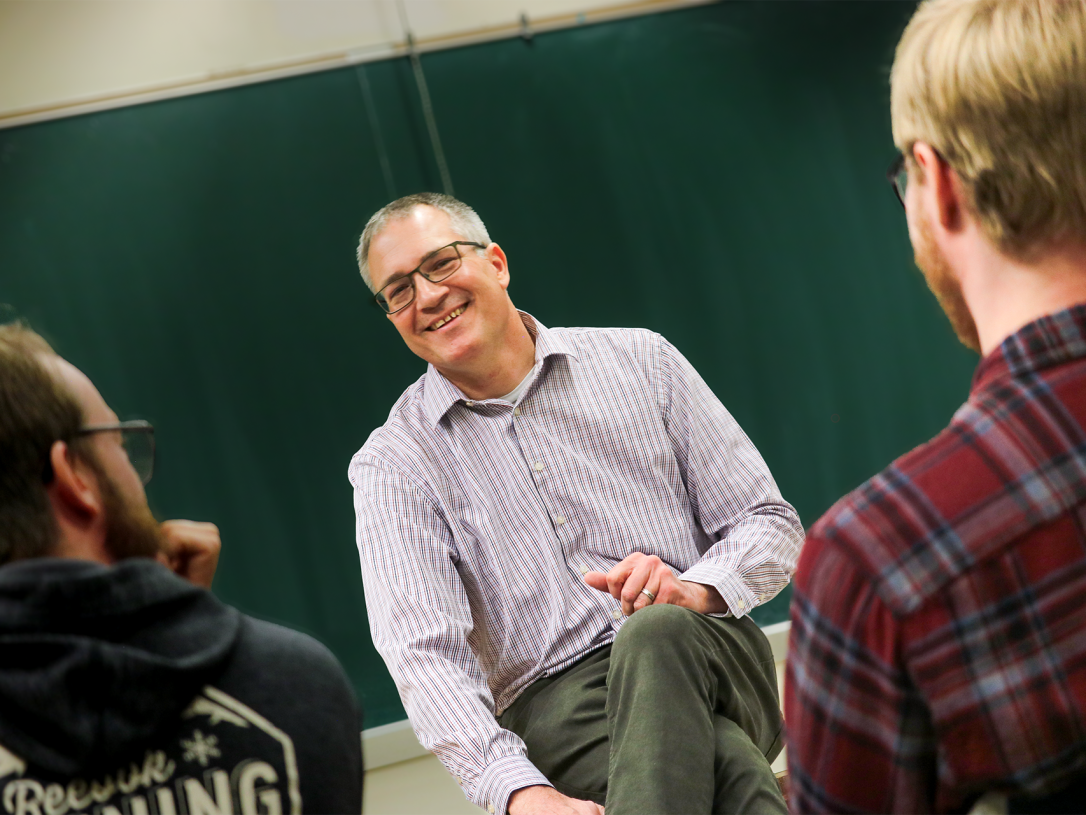 Dr. Roberts has a laugh with his class