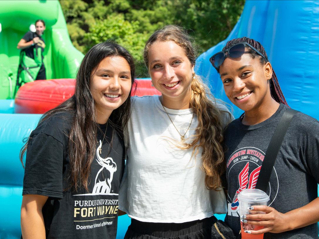 Three smiling students