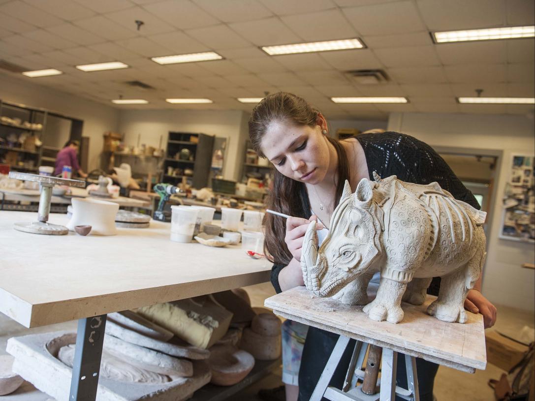 Visual Arts student working on her sculpture.