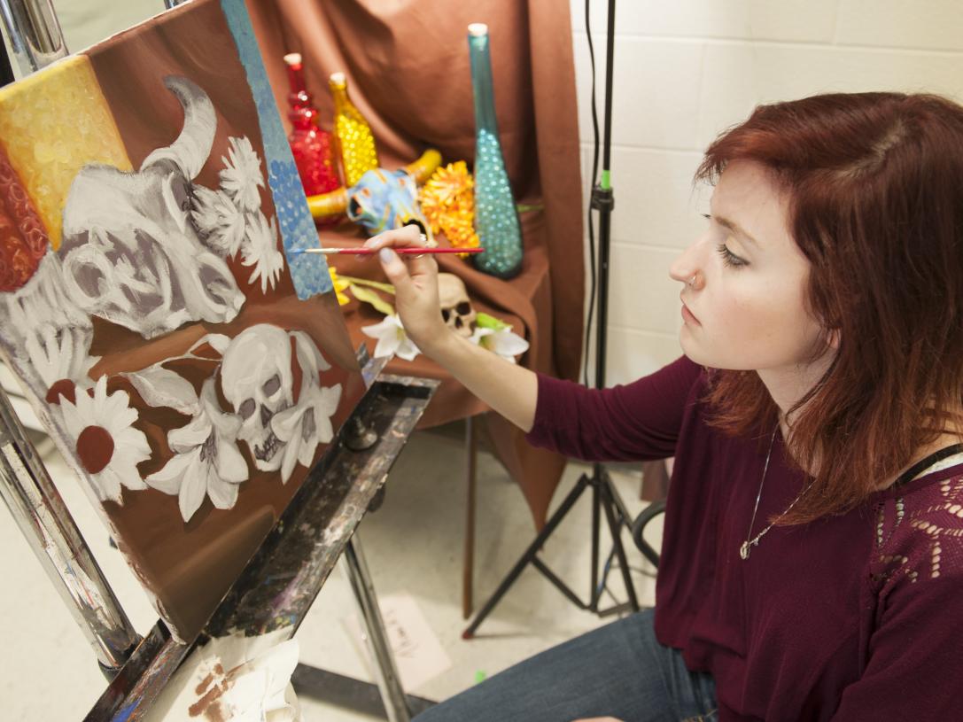 A student working in a painting lab
