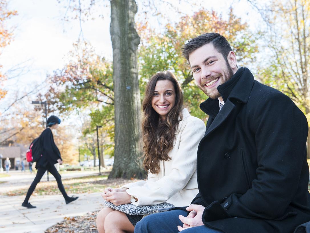 Students sitting on a bench.