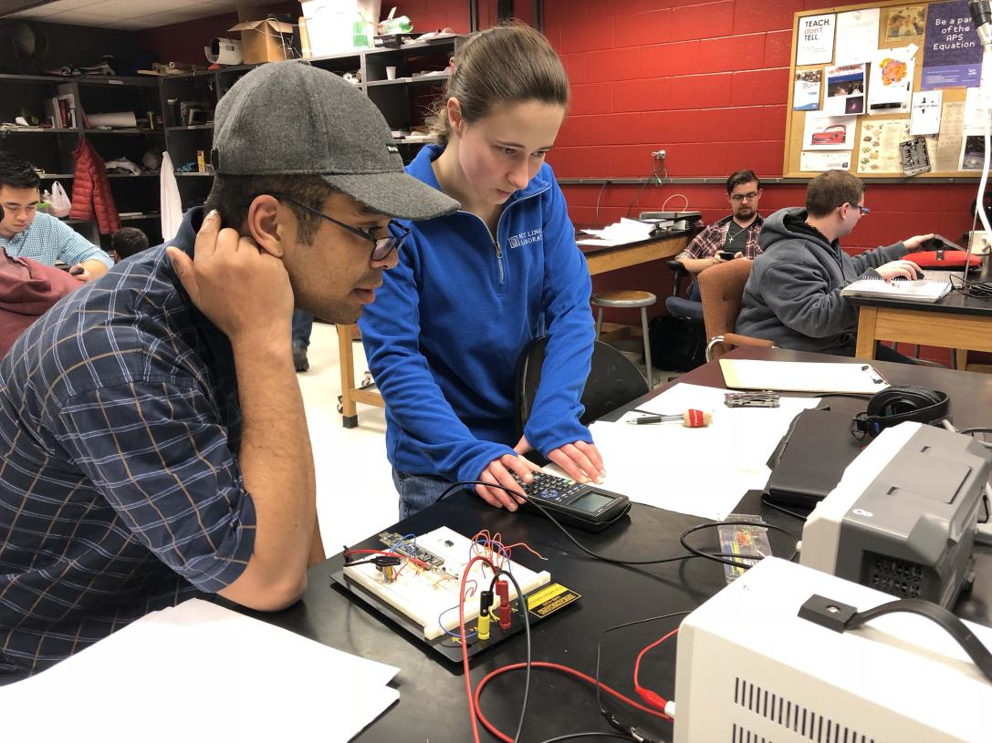Physics student working on a lab experiment.