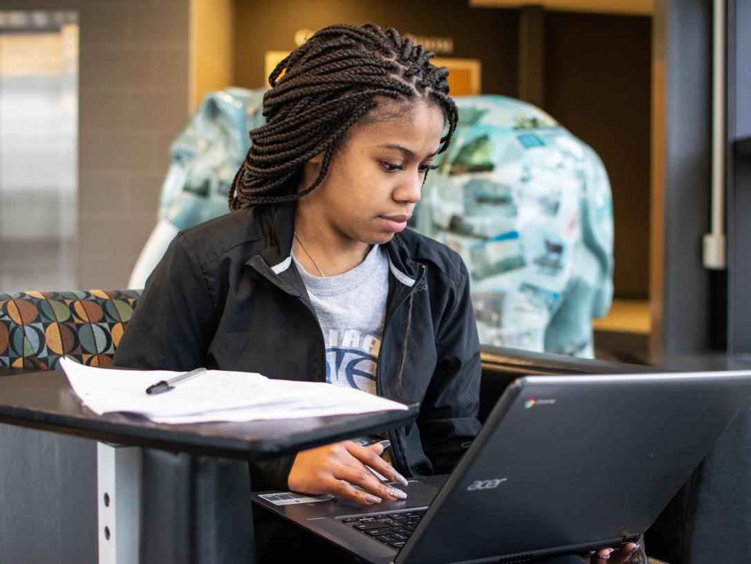Student studying her class notes.